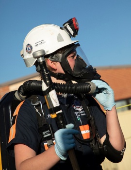 A photo of a female member of the mine rescue crew in full gear